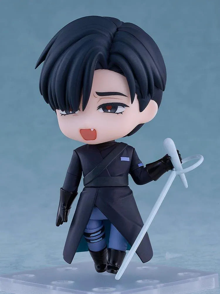 ALIEN STAGE Nendoroid Ivan Figure featuring a black-haired anime character with dark eyes, a small fang, a dark long-sleeved outfit, black gloves, and matching boots while holding a light-blue accessory.