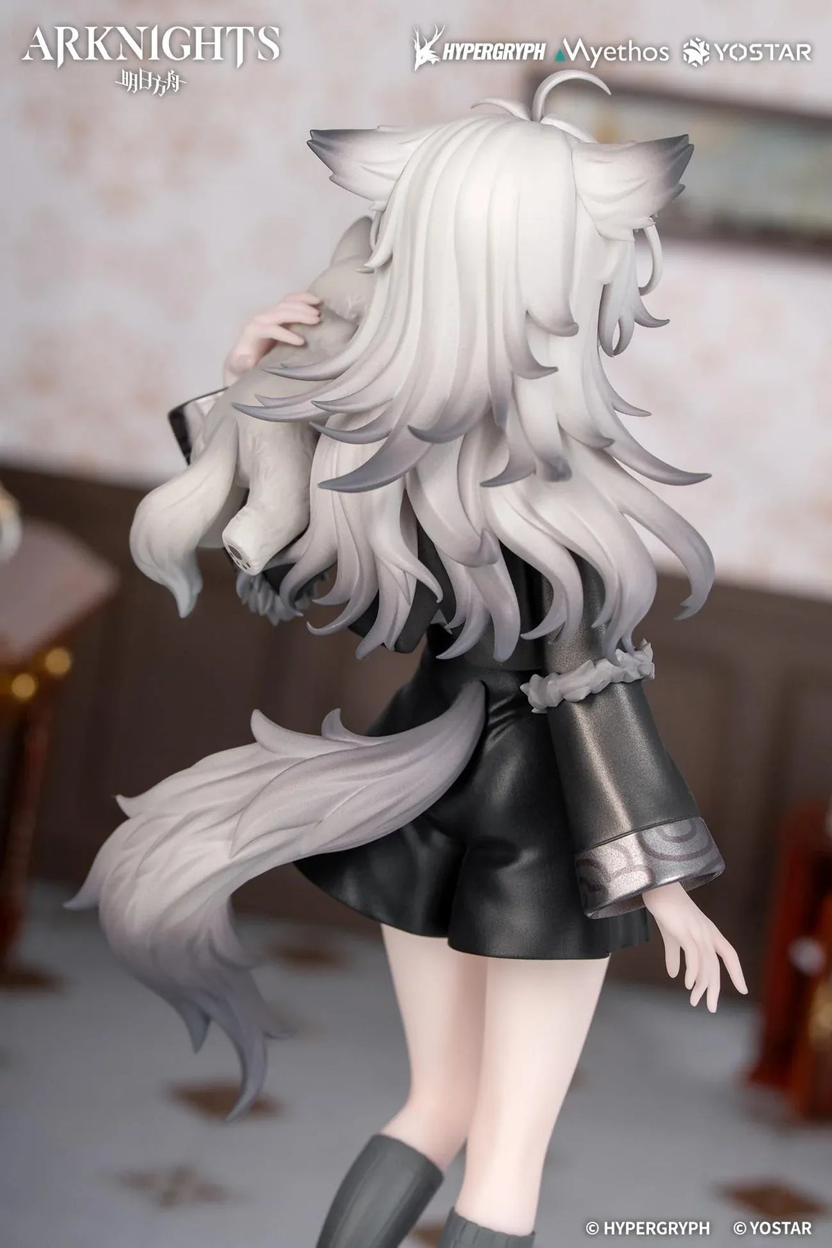 Arknights Rhodes Kids Series Lappland figure wearing a black-and-white uniform and holding a small wolf companion.