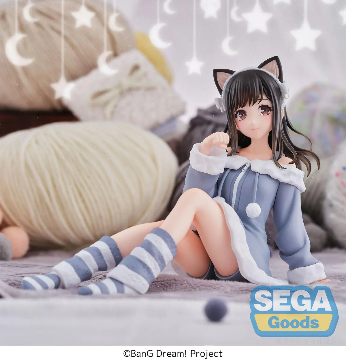 BanG Dream! Mana Sumita Pajama Party figure seated in a blue-gray outfit with white trim, cat-ear headband, striped socks, and one hand raised.