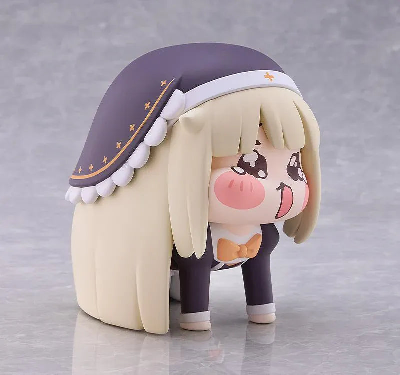 Petite Speaki soft vinyl figure with blonde hair, rosy cheeks, sparkling eyes, and a dark hood with gold accents.