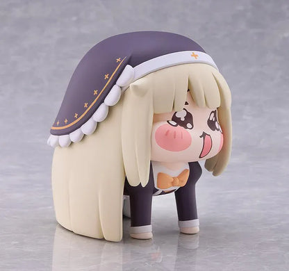 Petite Speaki soft vinyl figure with blonde hair, rosy cheeks, sparkling eyes, and a dark hood with gold accents.