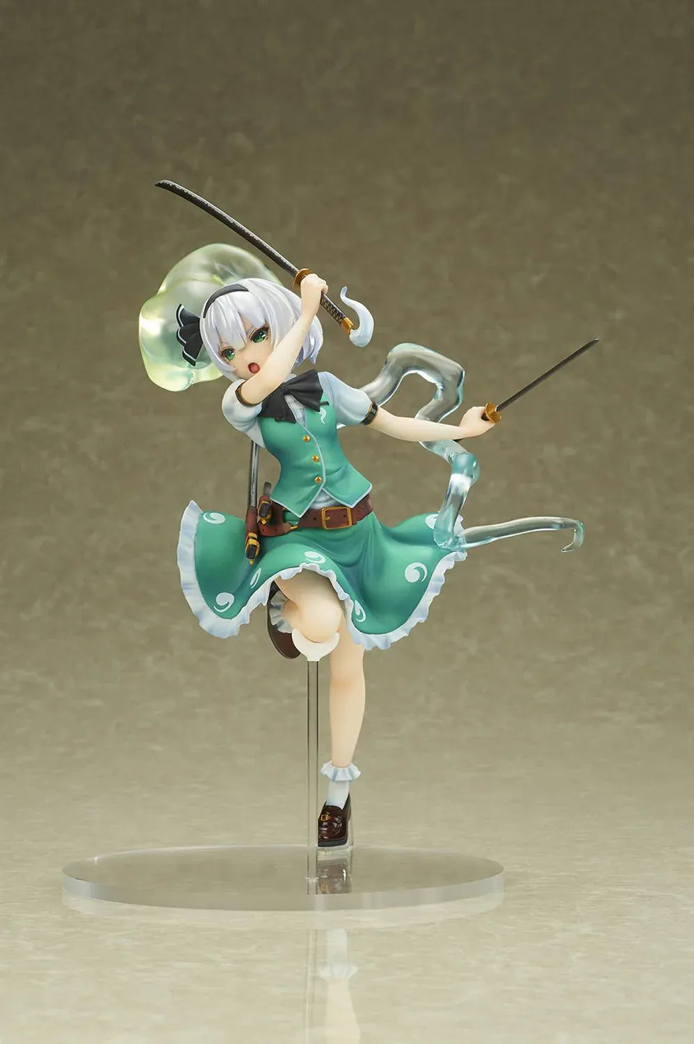 Touhou Project Youmu Konpaku figure wielding two swords in an airborne pose, wearing a green outfit with a translucent swirling spirit effect.