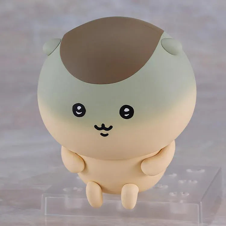 Chiikawa Nendoroid Kurimanju Figure featuring a round beige character with a chestnut-brown head, rosy pink cheeks, expressive black eyes, an open mouth, tiny arms, and small feet.