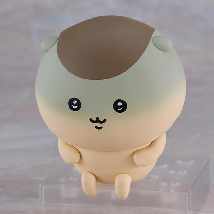 Chiikawa Nendoroid Kurimanju Figure featuring a round beige character with a chestnut-brown head, rosy pink cheeks, expressive black eyes, an open mouth, tiny arms, and small feet.