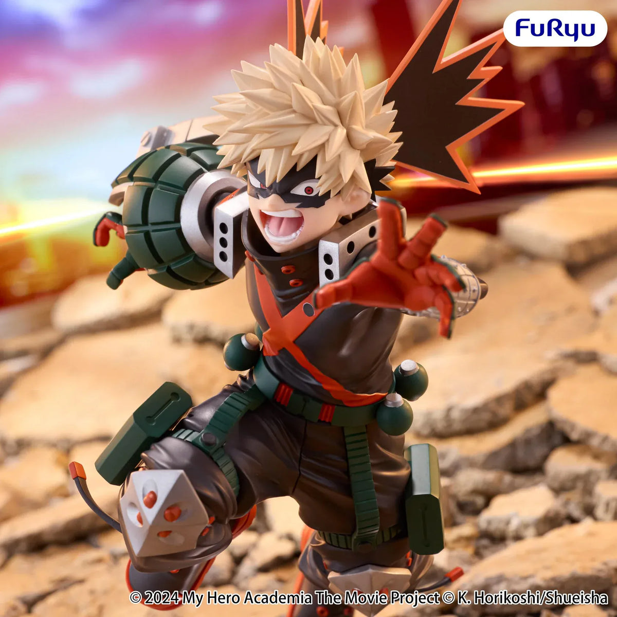 Katsuki Bakugo Muchute figure in his hero costume performing a dynamic airborne attack pose with grenade-shaped gauntlets.