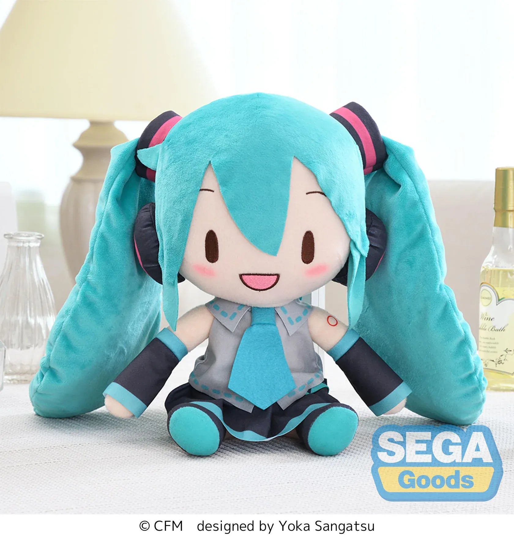 Fuwa Petit Hatsune Miku L Plush with turquoise twin tails, headset, embroidered smile, and classic black and teal outfit