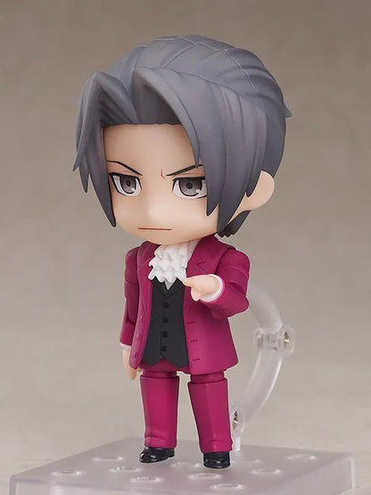 Ace Attorney Miles Edgeworth Nendoroid rerelease figure wearing a burgundy suit and pointing beside a Japanese Objection effect part.