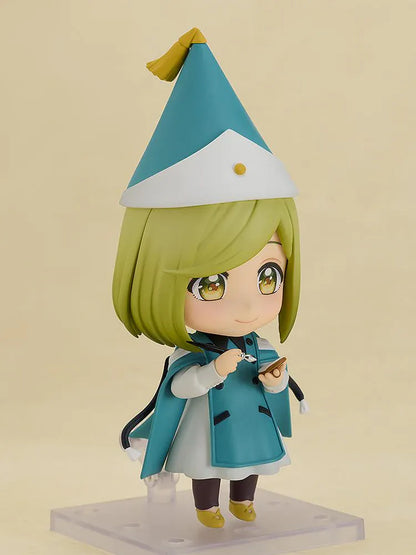 Nendoroid Coco figure from Witch Hat Atelier wearing witch hat and teal outfit in chibi style