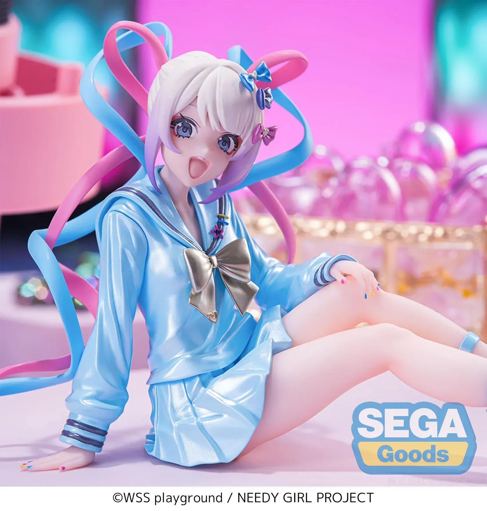 Figure of OMGKawaiiAngel sitting in a perching pose with pastel ribbons, glossy outfit, and energetic expression.