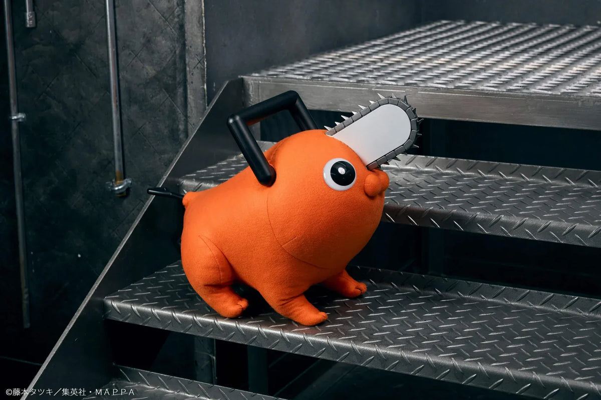 Chainsaw Man life-size Pochita doll figure with an orange body, glossy eyes, chainsaw blade, black handle, and pull cord.