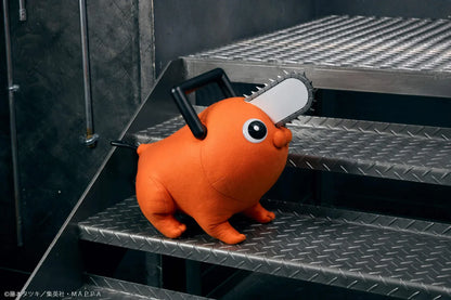 Chainsaw Man life-size Pochita doll figure with an orange body, glossy eyes, chainsaw blade, black handle, and pull cord.