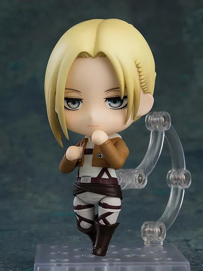 Attack on Titan Nendoroid Annie Leonhart rerelease figure with blonde hair, military uniform, dual blades, and vertical maneuvering equipment.