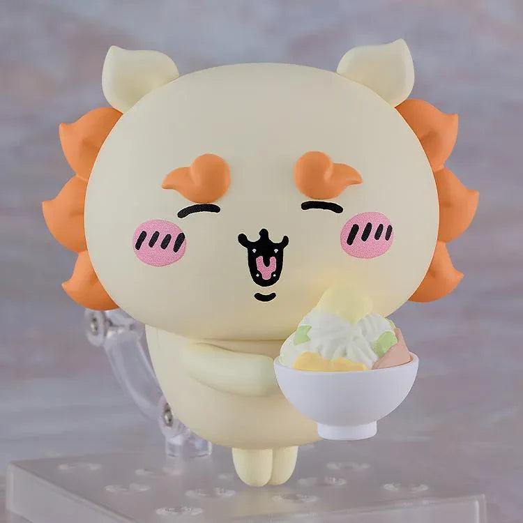 Chiikawa Nendoroid Shisa figure with a cream-colored body, orange mane and eyebrows, pink cheeks, and a joyful smiling expression.