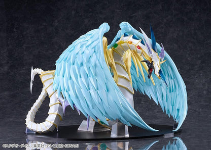 Yu-Gi-Oh! GX Rainbow Dragon figure with a pearlescent armored body, multicolored crystals, gold accents, and translucent blue wings.
