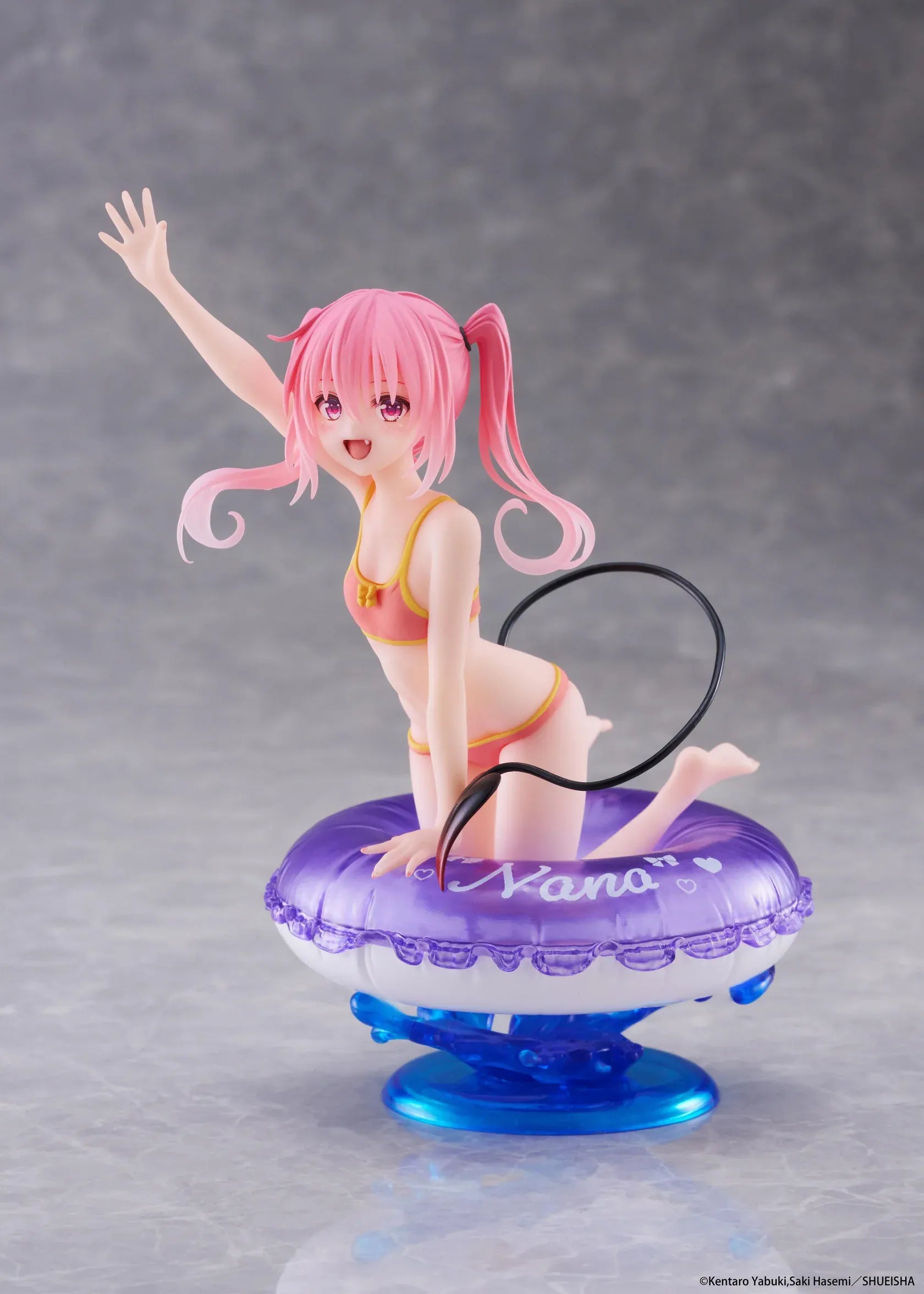 To Love-Ru Darkness Aqua Float Girls Nana figure featuring Nana with pink twin tails in a swimsuit posing on a purple float ring display base