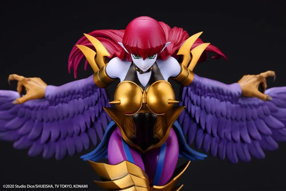Harpie Lady figure posed in flight with outstretched purple wings, red hair, and gold Cyber Shield armor above a black display base.