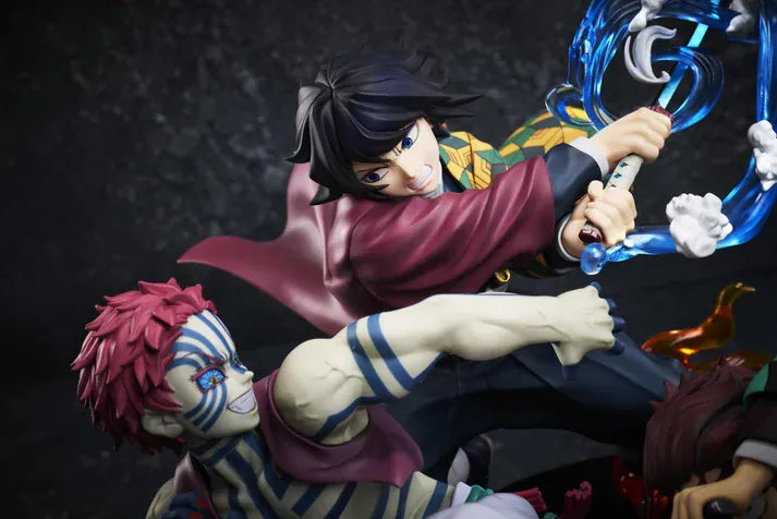 Demon Slayer Tanjiro Kamado, Giyu Tomioka, and Akaza vignette figure featuring translucent water and fire battle effects.