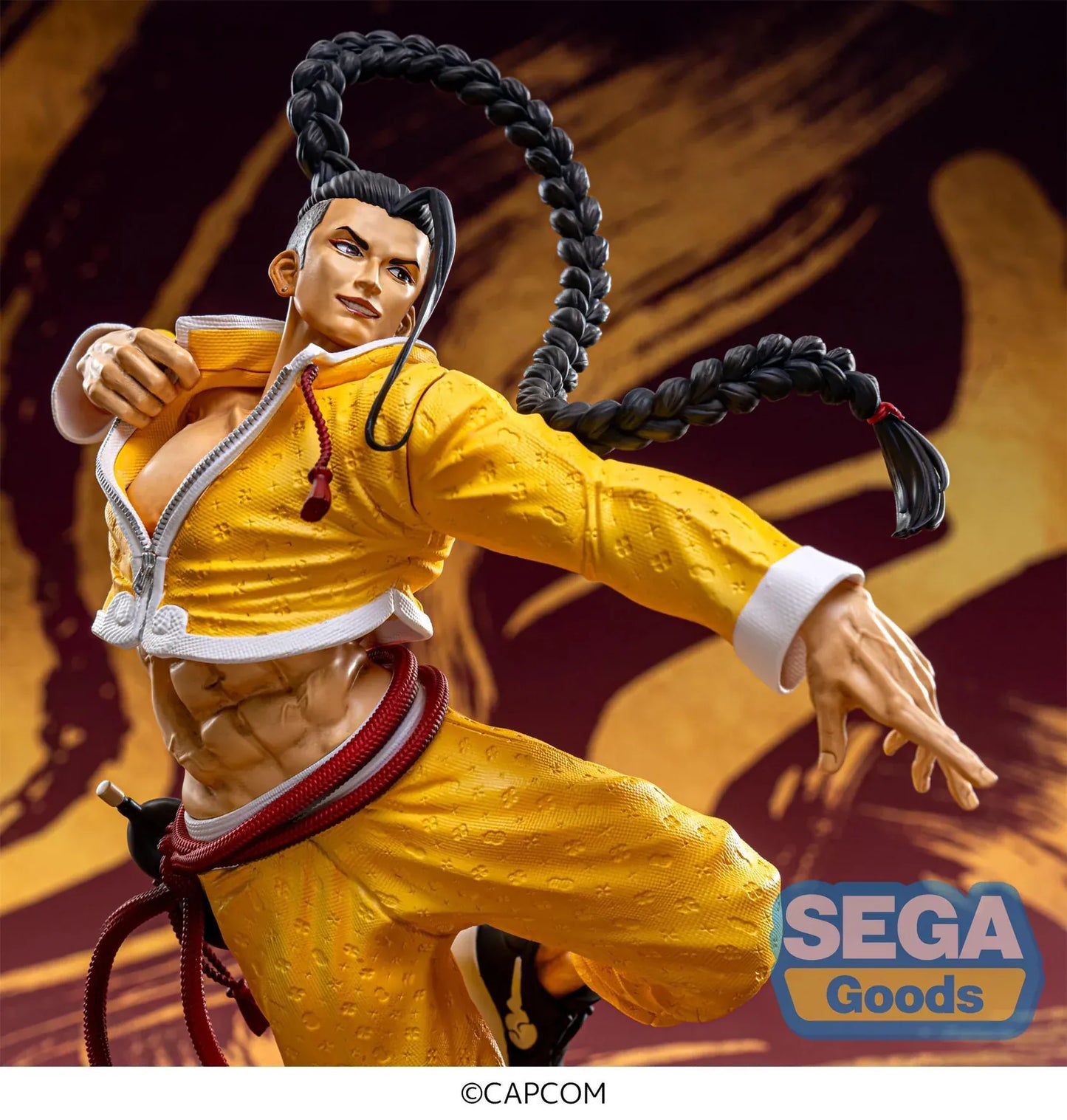 Street Fighter 6 FiGURiZMa Jamie figure in a dynamic martial arts pose with signature yellow outfit and braided hair