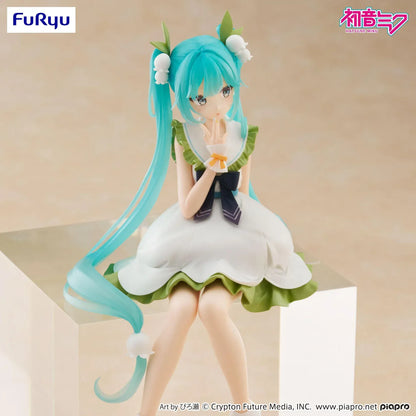 Seated Hatsune Miku Flower Fairy Lily of the Valley noodle stopper figure in a white and green dress with long twin-tails and lily-of-the-valley hair accessories.