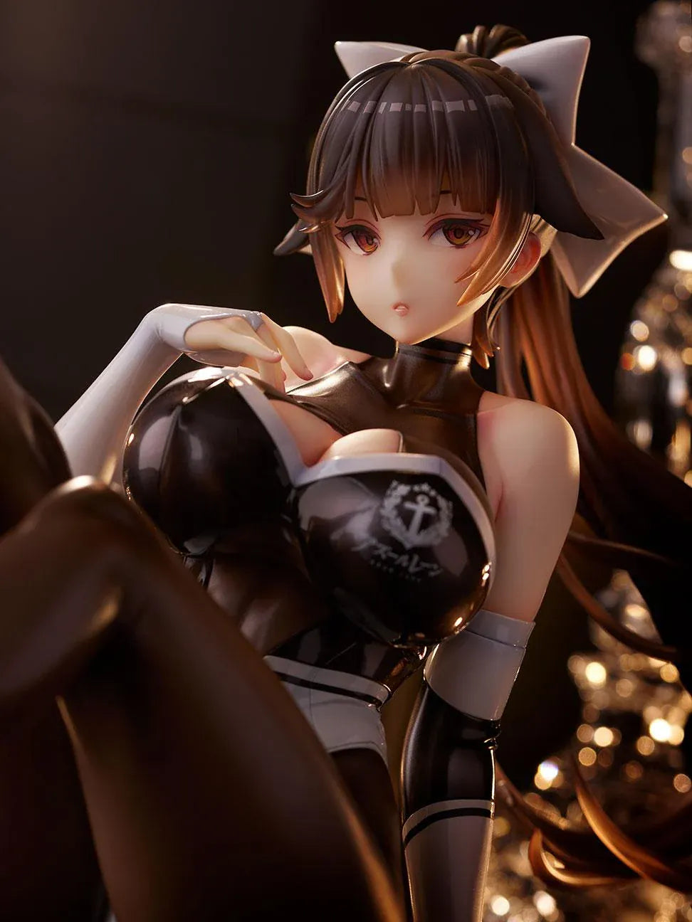Azur Lane Takao Full Throttle Charmer figure seated with one leg raised, wearing a black and white outfit, dark stockings, and a white hair bow.