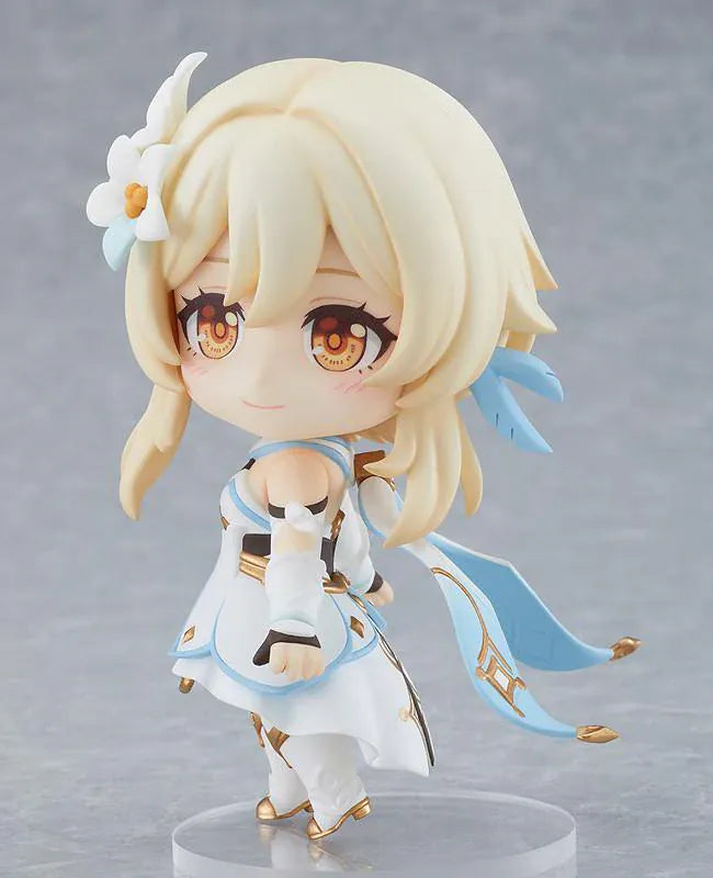 Genshin Impact Nendoroid Traveler Figure Lumine Rerelease featuring Lumine with blonde hair, golden eyes, white-and-blue fantasy outfit, flower hair accessory, and sword accessory.