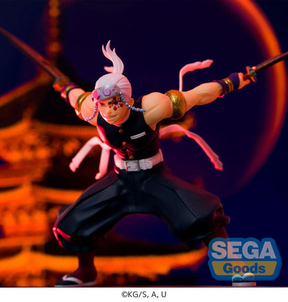 Demon Slayer FIGURIZMα Tengen Uzui figure in a wide stance with twin chained blades extended, a jeweled headband, and gold arm bands on a white base.