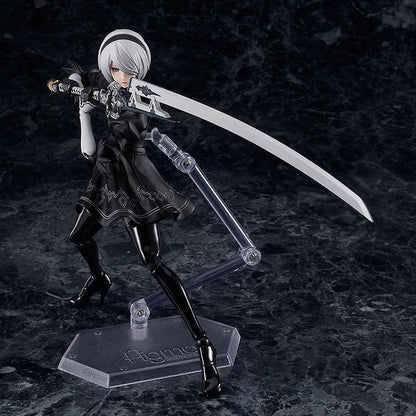 NieR Ver1.1a figma 2B figure with silver hair, a black visor, patterned black outfit, white sleeves, glossy boots, and a support robot.