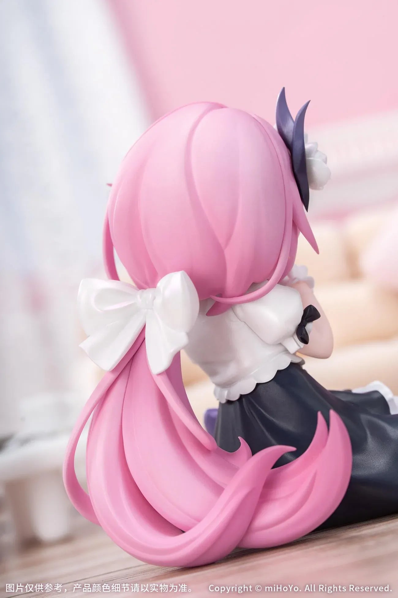 Honkai Impact 3rd Little Series Elysia Little Flame-Chaser Ver. Figure featuring Elysia with pink hair, chibi styling, black-and-white outfit, purple bow accents, and pastel heart cushion.