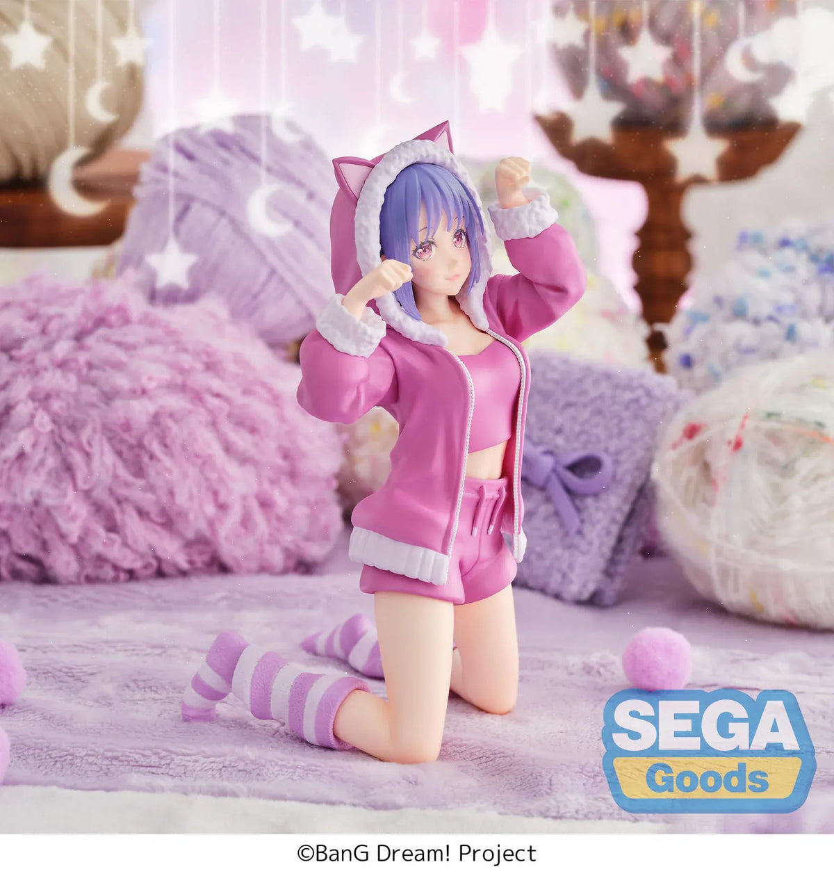 BanG Dream! Nyamu Yutenji Pajama Party figure kneeling in pink pajamas with a cat-ear hood, purple hair, striped socks, and both hands raised.