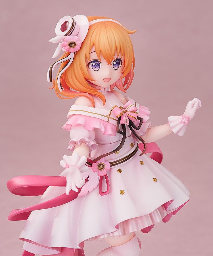 Is the Order a Rabbit Cocoa Dress Ver. 1/7 Scale Figure wearing an elegant pink and white frilled dress with ribbons and floral accessories