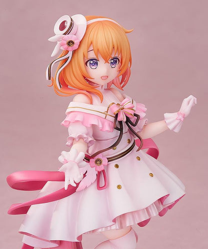 Is the Order a Rabbit Cocoa Dress Ver. 1/7 Scale Figure wearing an elegant pink and white frilled dress with ribbons and floral accessories
