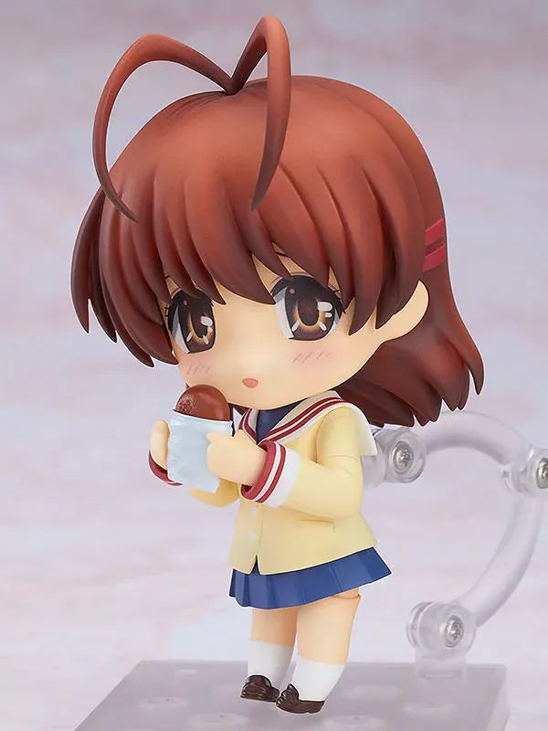 CLANNAD Nendoroid Nagisa Furukawa Figure featuring Nagisa in a chibi-style design with brown hair, cream cardigan, blue skirt, and school uniform details.