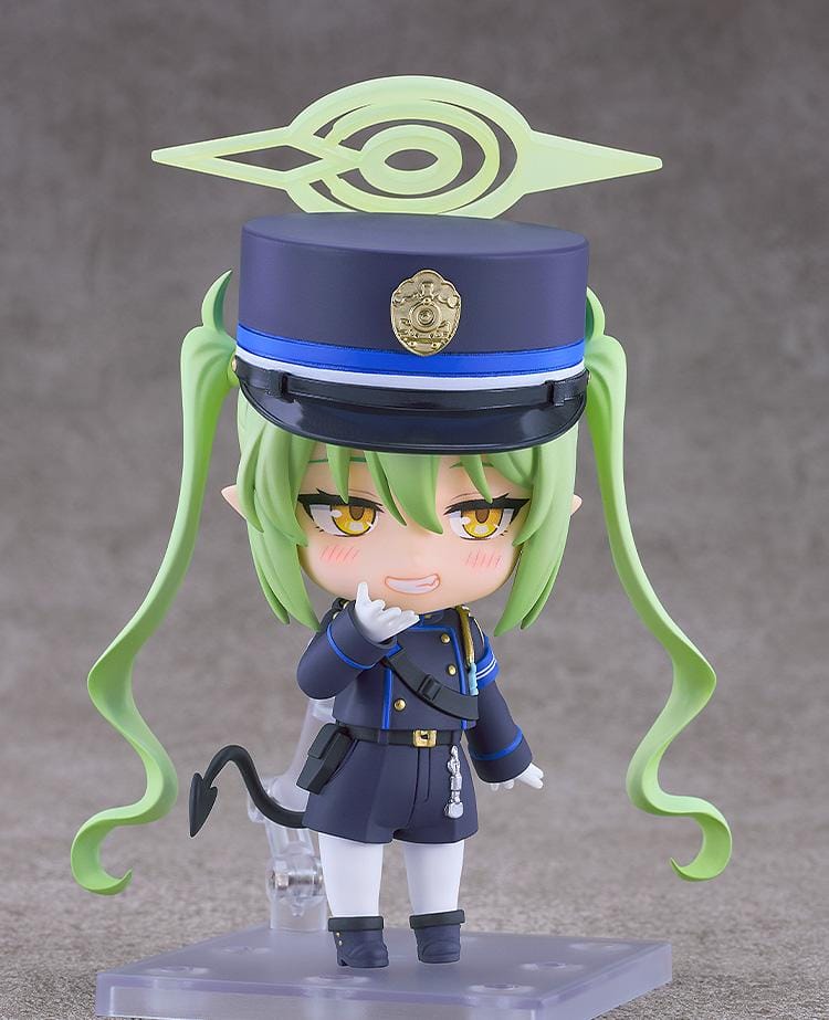 Blue Archive Nendoroid Nozomi Tachibana Figure featuring Nozomi with light green twin tails, golden eyes, oversized officer cap, academy uniform, and halo-style effect piece.