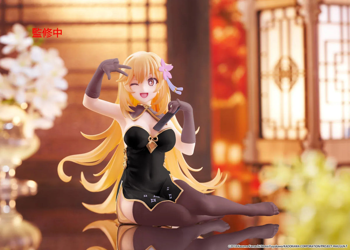 Desktop Cute Misaki Shokuho Chinese Dress Ver. figure seated in a black and gold dress, winking and holding a remote control, with flowing blonde hair