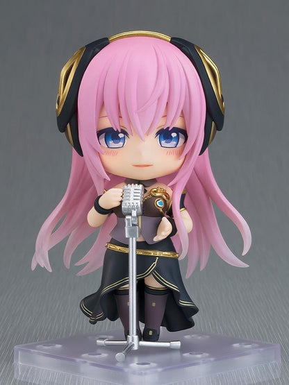 Hatsune Miku Nendoroid Megurine Luka V4X Figure with pink hair, headset, blue eyes, and black and gold Vocaloid outfit