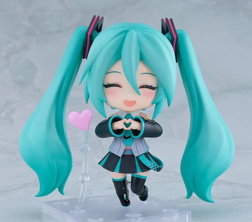 Hatsune Miku V6 Nendoroid figure with turquoise twin tails, an updated outfit, and interchangeable accessories.
