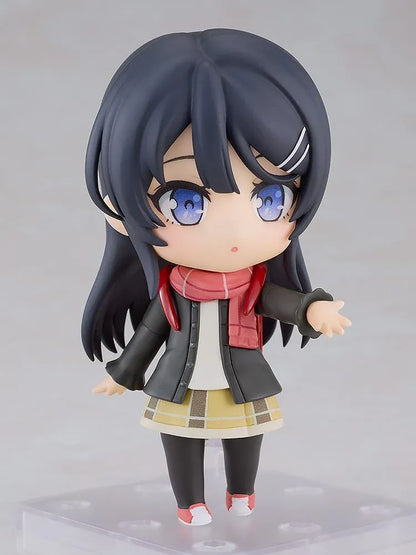 Rascal Does Not Dream Series Nendoroid Knapsack Kid Figure featuring a black-haired anime girl with blue eyes wearing a dark jacket, pink scarf, yellow plaid skirt, black tights, and pink sneakers while carrying a red backpack.