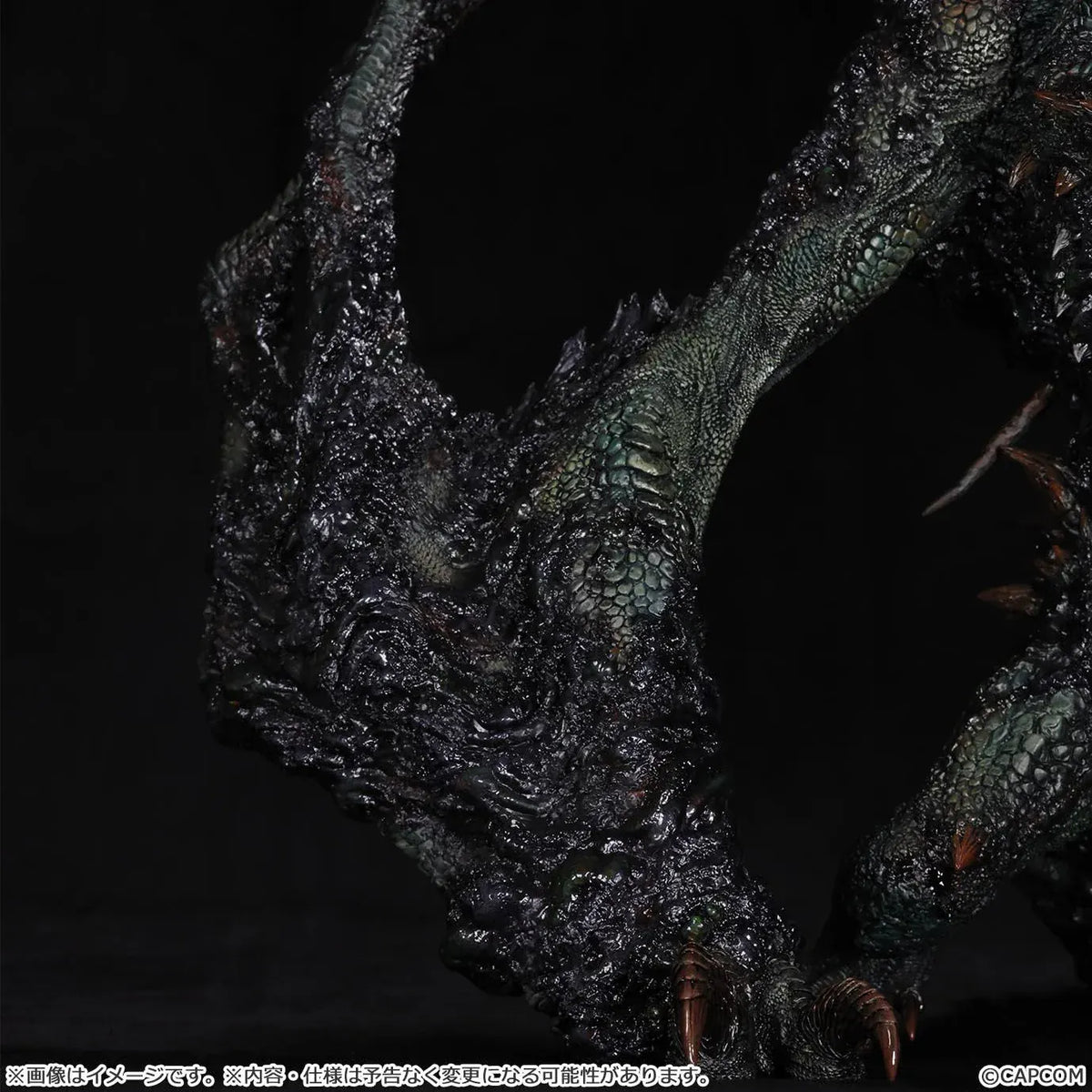 Monster Hunter Gogmazios Creator's Model XL figure roaring with dark textured scales, jagged spines, large claws, and red-orange chest accents.
