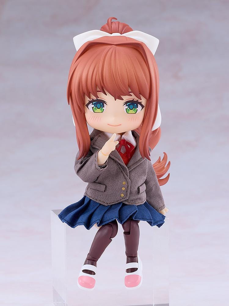 Doki Doki Literature Club! Nendoroid Doll Monika wearing a fabric brown blazer, blue pleated skirt, red ribbon, and white hair bow.