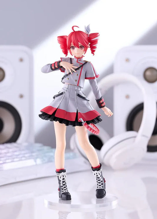 Kasane Teto Synthesizer V AI figure with red drill curls, a gray and red outfit, layered skirt, and black lace-up boots, posed with one hand across her chest.