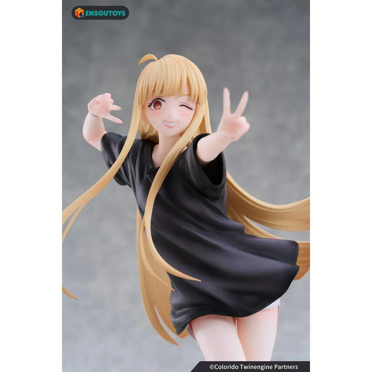 Kaguya In the Real World Ver. 1/7 scale figure with flowing blonde hair, a black outfit, blue sneakers, and a winking peace-sign pose.