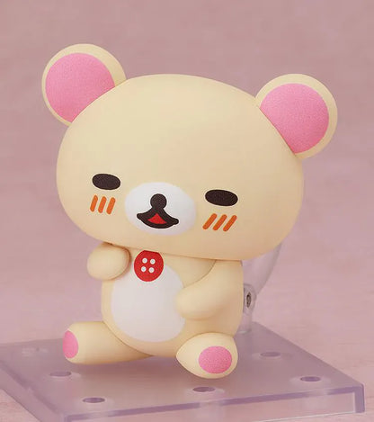 Rilakkuma Nendoroid Korilakkuma Figure with cream-colored bear design, pink ears, red button detail, white belly, and chibi display base