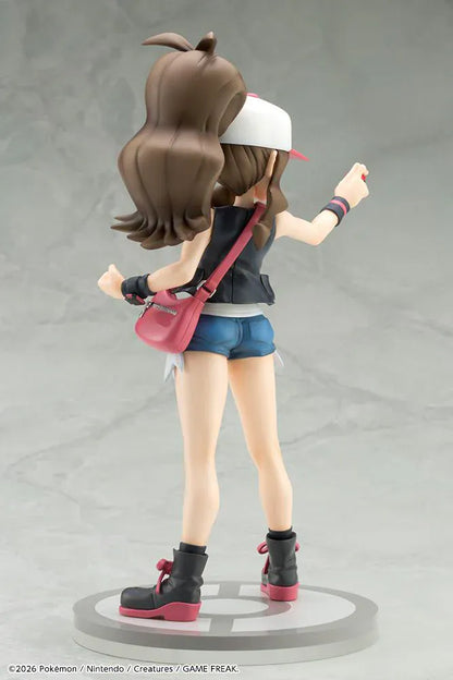 Pokemon ArtFX J Hilda with Tepig 1/8 Scale Figure Rerun featuring Hilda in her trainer outfit holding a Poké Ball with Tepig and flame effect on a display base.
