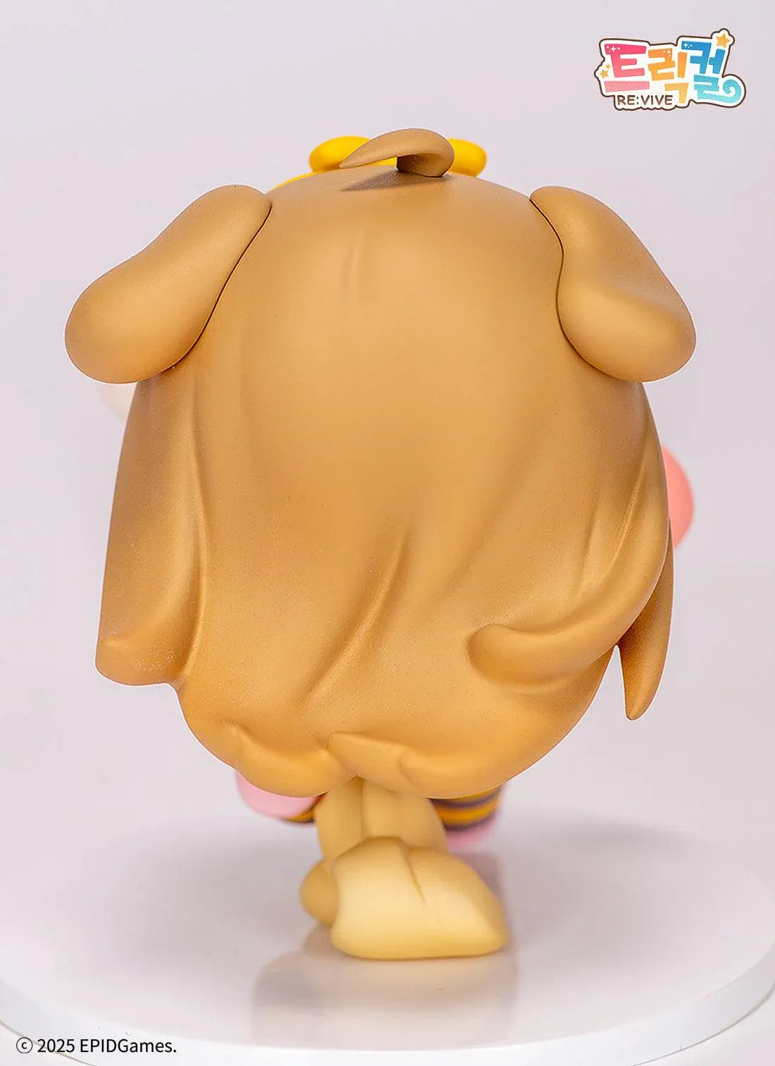 Trickal Chibi Go Butter Non Scale Figure (Rerelease) featuring a cheerful brown-haired character with floppy dog ears, a yellow bow, pink shorts, striped stockings, and a puppy-shaped shoulder bag.