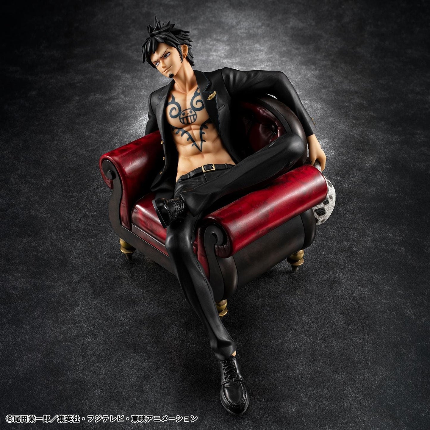 One Piece Portrait Of Pirates S.O.C. Trafalgar Law Ver. R Figure wearing a black suit and sitting in a red armchair