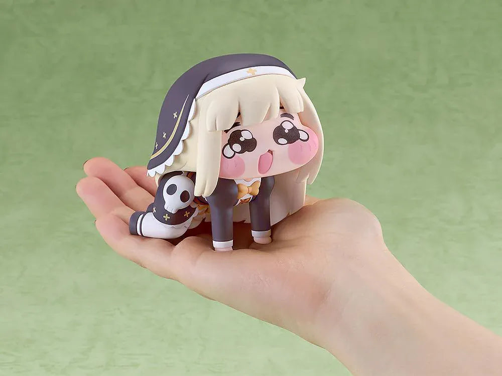 POP UP PARADE Petite Speaki figure with blonde hair, sparkling eyes, rosy cheeks, and a dark hood with gold accents and a skull detail.