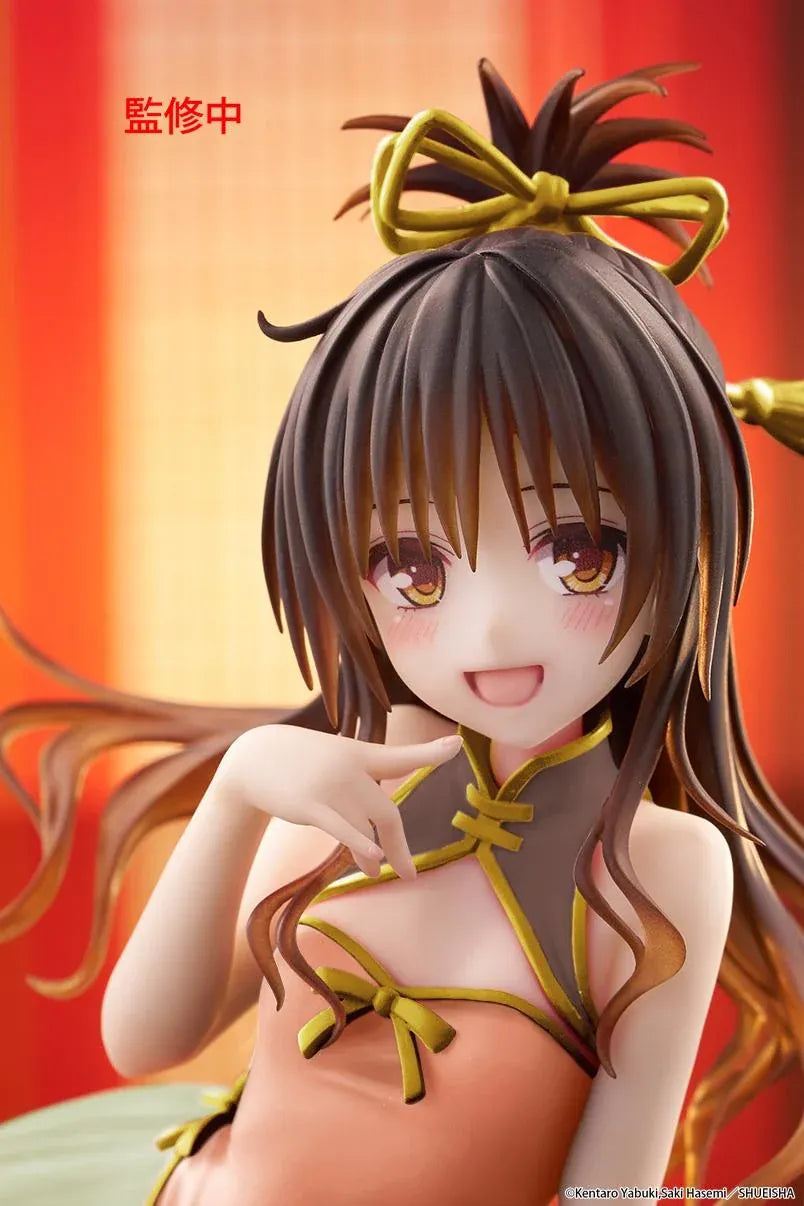 To Love-Ru Darkness Desktop Cute Mikan Yuki Chinese Dress Ver. Figure (Rerelease) featuring a brown-haired anime girl with golden eyes wearing an orange Chinese-style dress with gold trim, a light green ruffled skirt, and decorative hair ribbons in a seated pose.