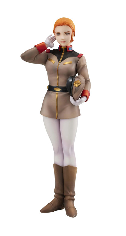 Gundam Girls Generation Matilda Ajan figure saluting in a tan military uniform and peaked cap, holding a green folder, with white trousers and brown boots.