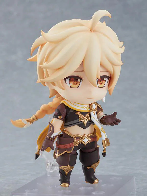 Genshin Impact Nendoroid Traveler Figure Aether Rerelease featuring Aether with blonde hair, golden eyes, fantasy outfit details, yellow cape, and sword accessory.