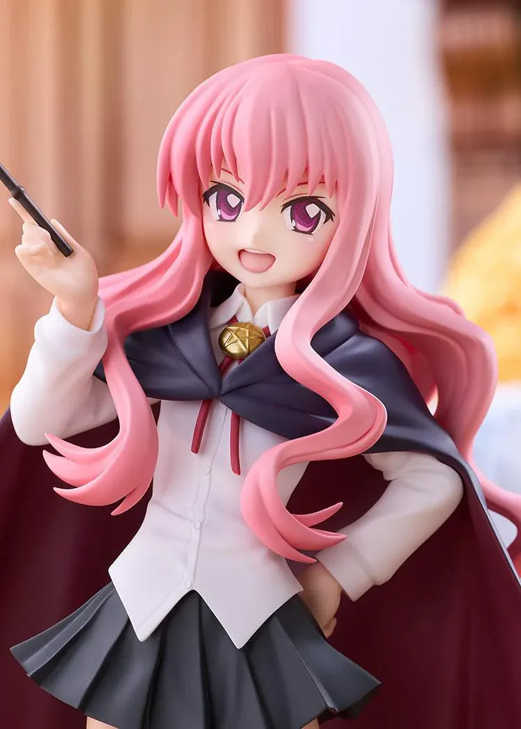 POP UP PARADE Louise L Size figure with flowing pink hair, a raised wand, white blouse, dark skirt, and a cape with burgundy lining.